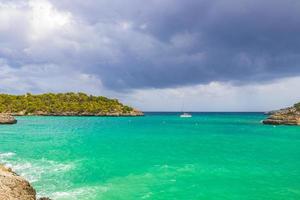 Turquoise beach bay Cala Samarador Amarador Mallorca Balearic Islands Spain. photo