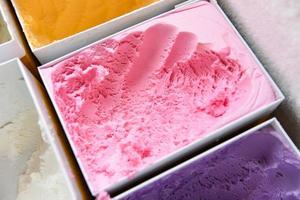 ice cream scoop, colorful ice cream in box photo