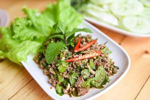 Spicy Minced Pork Salad with fresh vegetable, Beef meat Salad Thai food photo