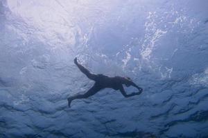 woman snorkeling at the surface