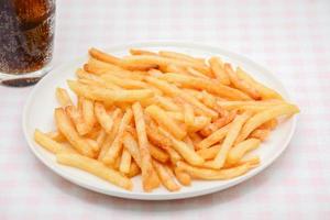 French fries on white dish and white background. photo