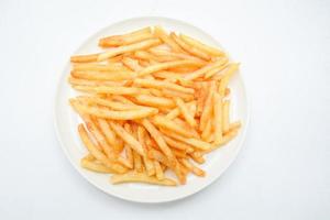 French fries on white dish and white background. photo