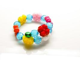 Multi-colored bracelets with beads. Colourful child's bead bracelet. photo