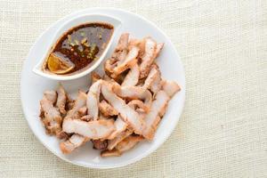 Grilled Pork with Thai Spicy Sauce. it can be served as an appetizer. photo