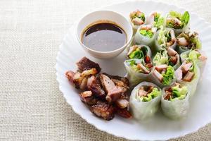 Fresh assorted Asian spring rolls with grilled pork, fresh vegetable. Healthy and delicious dish photo