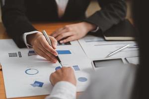 Businessman meeting and working with financial report, talking about business plan for investment, finance analysis concept photo