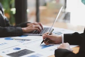 business advisor meeting to analyze and discuss the situation on the financial report in the meeting room.Investment Consultant,Financial Consultant,Financial advisor and accounting concept photo