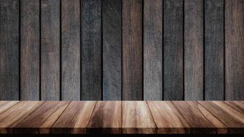 Empty wood table with old wooden wall background. photo