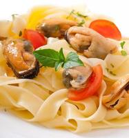 pasta with shrimps and tomatoes photo