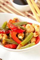 Chicken breast with vegetables and sauce decorated with basil leaves photo