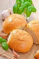 Homemade buns with garlic and green basil photo