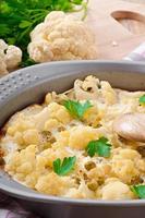 cauliflower baked with egg and cheese with green peas photo