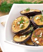 Platter of grilled eggplant with garlic and dill photo