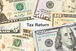 Tax Return and dollar banknote taxation concept photo