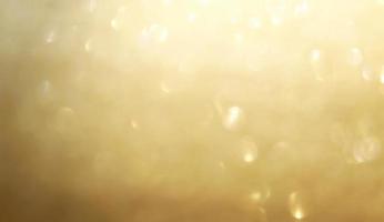 Abstract gold glister Christmas light bokeh background. photo