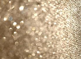 Abstract gold glister Christmas light bokeh background. photo