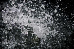 Water Splash on black background.Stylish water splash. Isolated on black background. photo