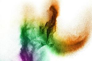 Abstract colorful dust particles textured background.Multicolored particles explosion on white background. photo