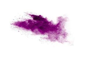 Pink powder explosion.Closeup of Pink dust particle explosion isolated on  white background. photo