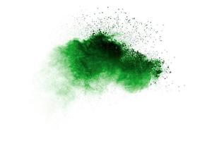 Abstract green dust explosion on white background. photo