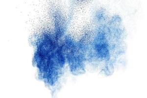 Blue color powder explosion on white background. photo