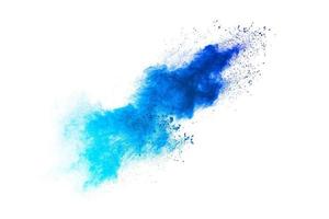 Splash of blue colored powder. Blue particles splatter on white blackground. photo