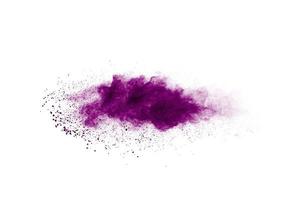 Purple color powder explosion cloud  on white background.Purple dust particles splash on background. photo