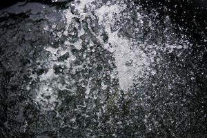 Water Splash on black background.Stylish water splash. Isolated on black background. photo