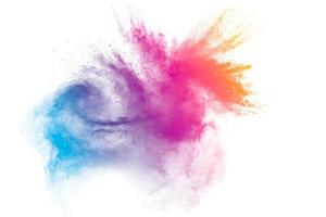 Pastel color dust particle splashing.Colorful powder explosion on white background. photo