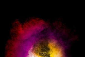 Abstract of colored powder explosion isolated on black background. photo