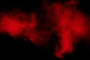 Freeze motion of red dust particles splashing. photo