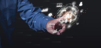 Businessman touching AI on cloud computing with the virtual world. Uses Technology Artificial Intelligence to growth business to the future. Digital technology, investment, internet network concept. photo
