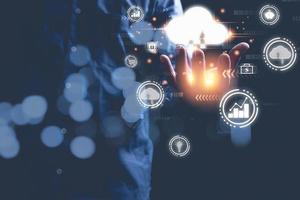 Protection database, business, internet digital network, technology concept. Businessman holding icon cloud computing with network and data information in hand. photo