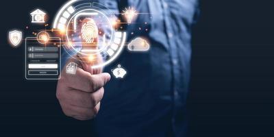 Businessman scanning his finger to gain access to privacy and data protection from hacking. Cyber security concept, finger scan print login, private data encryption, internet security. photo