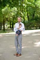 Dad walks with her daughter in the park photo