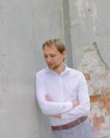 businessman in a white shirt on the streets of the old city photo