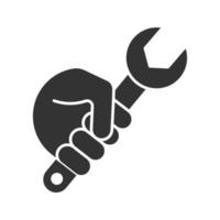 Hand holding wrench glyph icon. Silhouette symbol. Combination spanner. Negative space. Vector isolated illustration