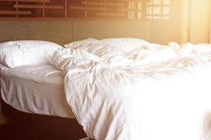 Bed sheet in hotel mess after customers left photo