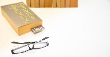 read glasses selective focus on blur Bookmark in old book on white background high angle view photo