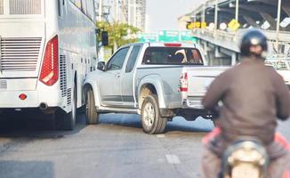 Pick-up truck bump Bus by accident on traffic road photo