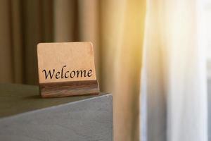 welcome sign on table photo