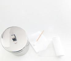 swab ,gauaze ,roll bandage and jar  with copy space in medical concept photo