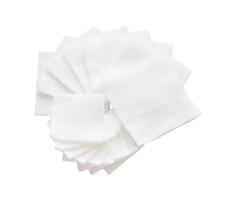 Pile of big and small size pad gauzes on isolated white background in fan shape photo