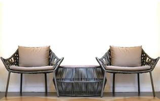 Sofa set of bamboo chairs and short table on floor in comfortable rest concept photo
