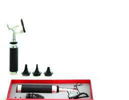 Otoscope for ear check for doctor ENT in box on blur background photo