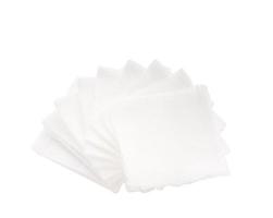 Pile of pad gauzes on isolated white background.jpg photo