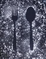 Fork and Spoon IMAGE ABOVE FLOUR, BLACK BACKGROUND. 12 FEBRUARY 2022 INDONESIA photo