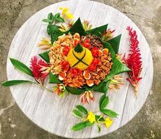 very beautiful decoration of Indonesian yellow rice cone photo