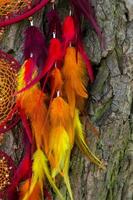 Handmade dream catcher with feathers threads and beads rope hanging photo