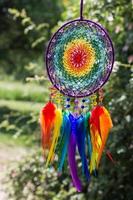 Handmade dream catcher with feathers threads and beads rope hanging photo